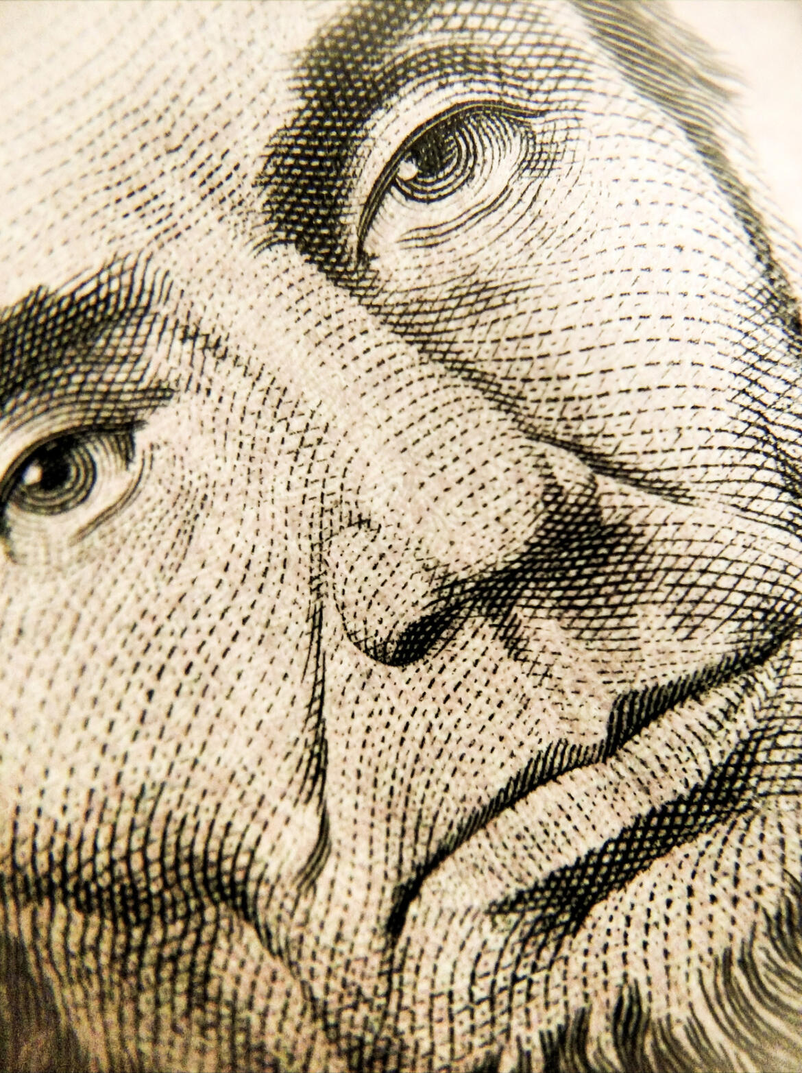 Close-up of abraham lincoln on the American five dollar bill.